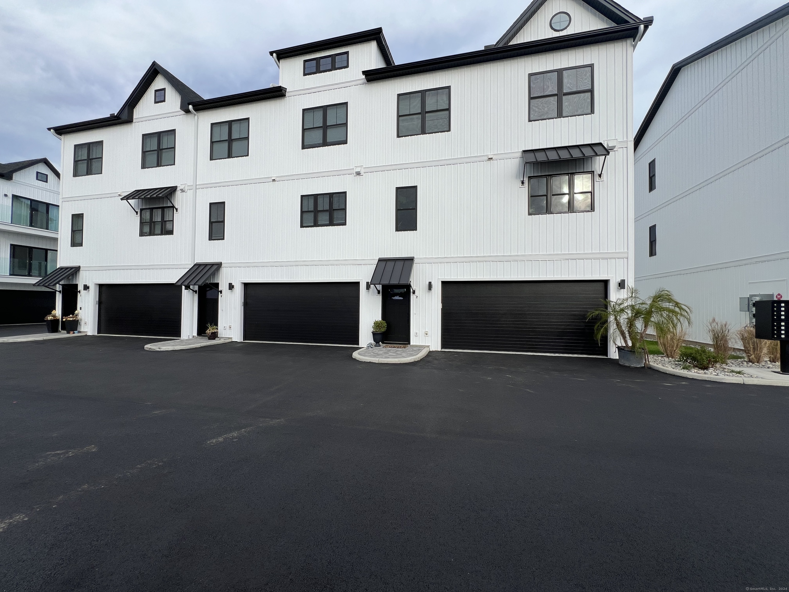 a view of building with parking space