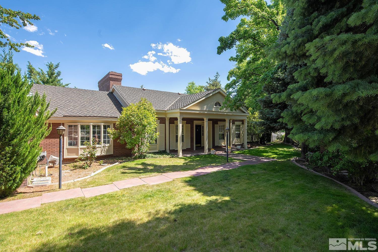 a view of a house with a yard