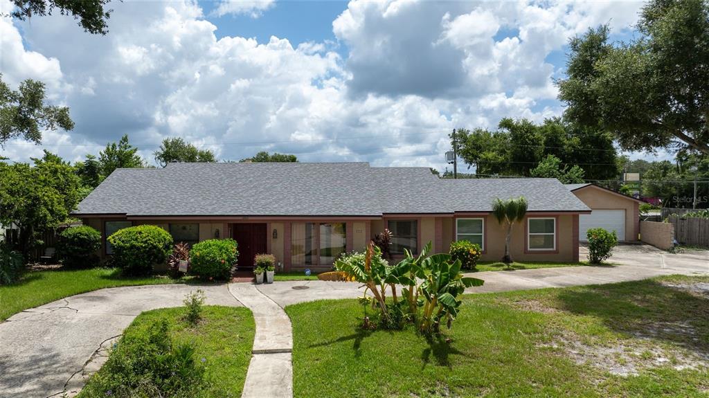 a aerial view of a house with swimming pool and porch