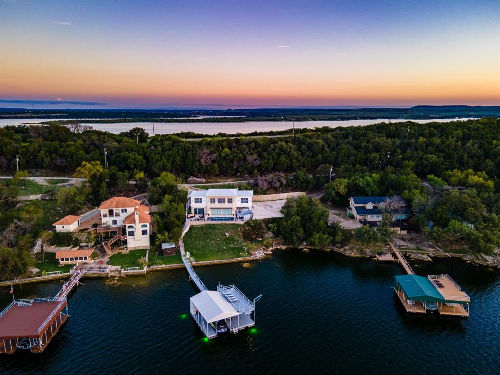 an aerial view of a house with a ocean view