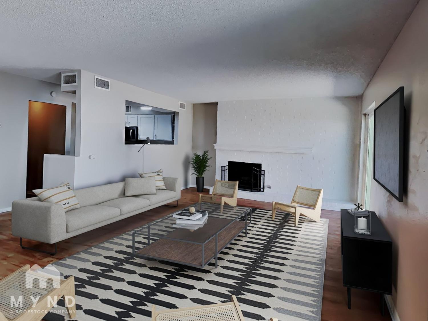 a living room with furniture and a flat screen tv