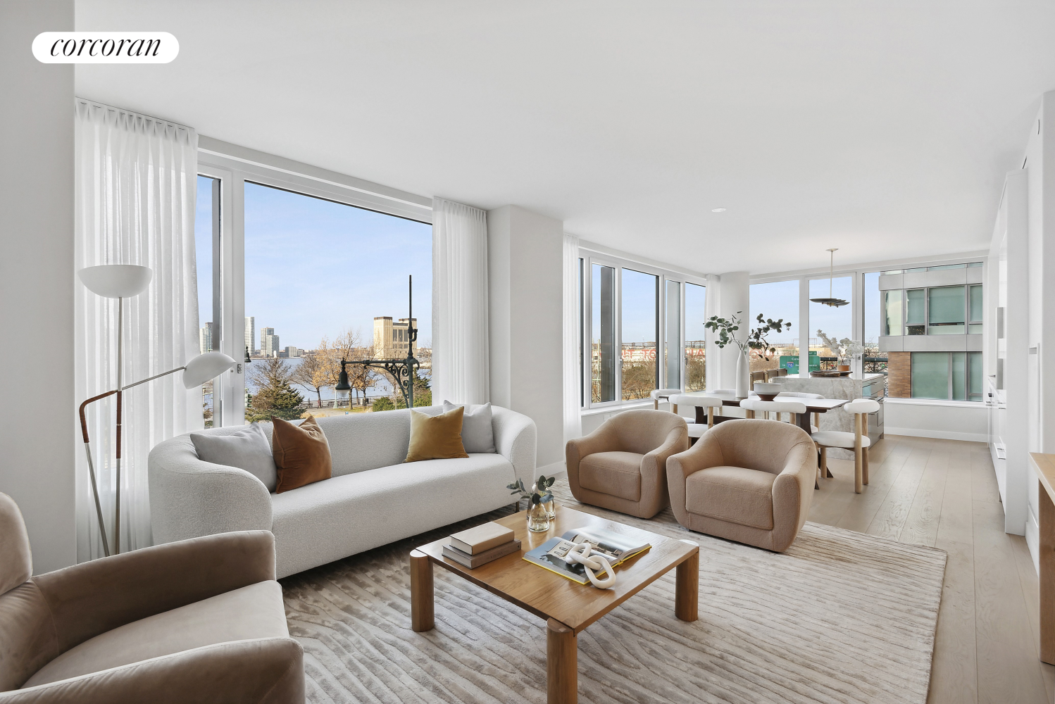 a living room with furniture wooden floor and a large window