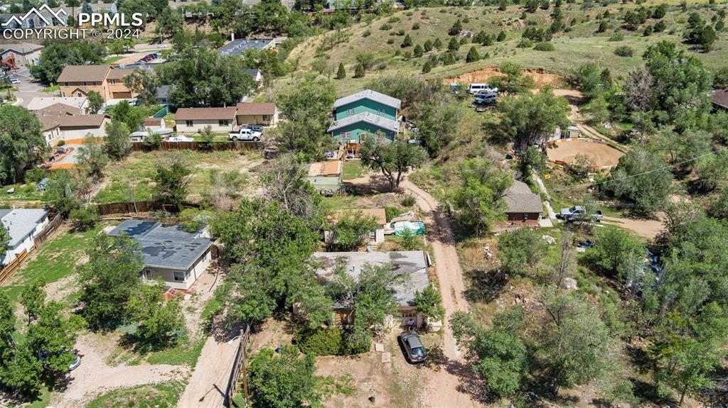 an aerial view of residential houses with outdoor space