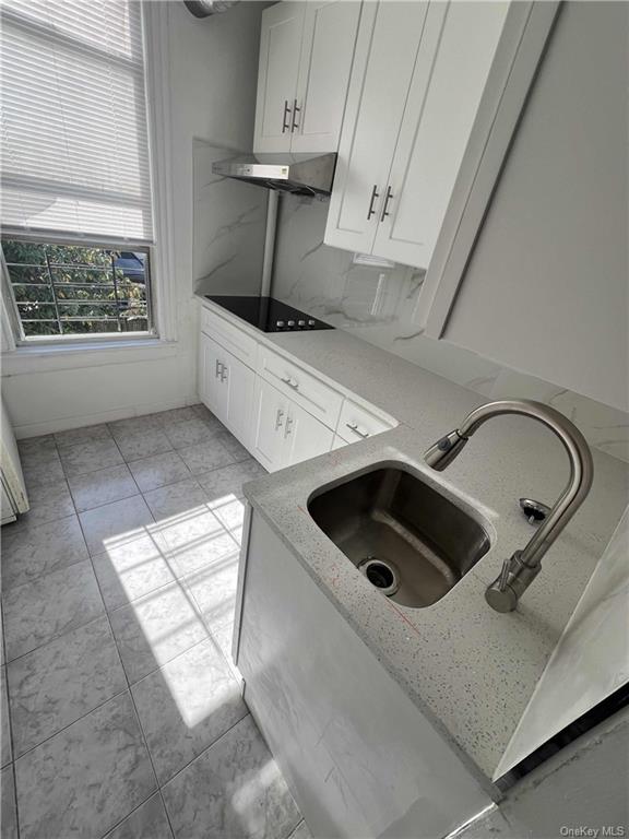 Laundry area featuring sink