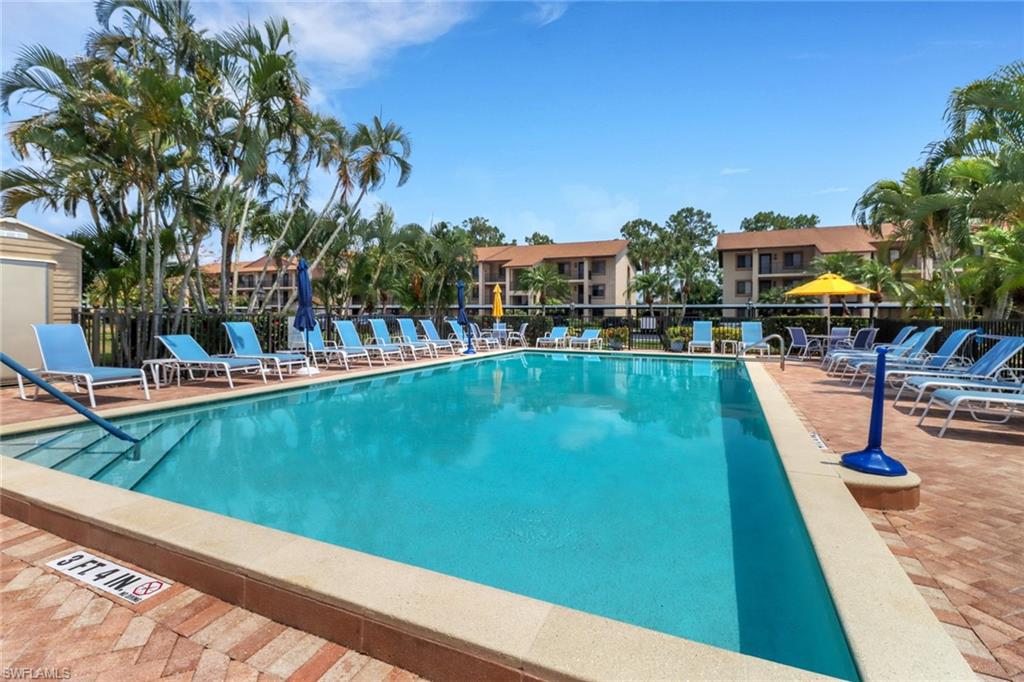 a view of a swimming pool with a lounge chairs