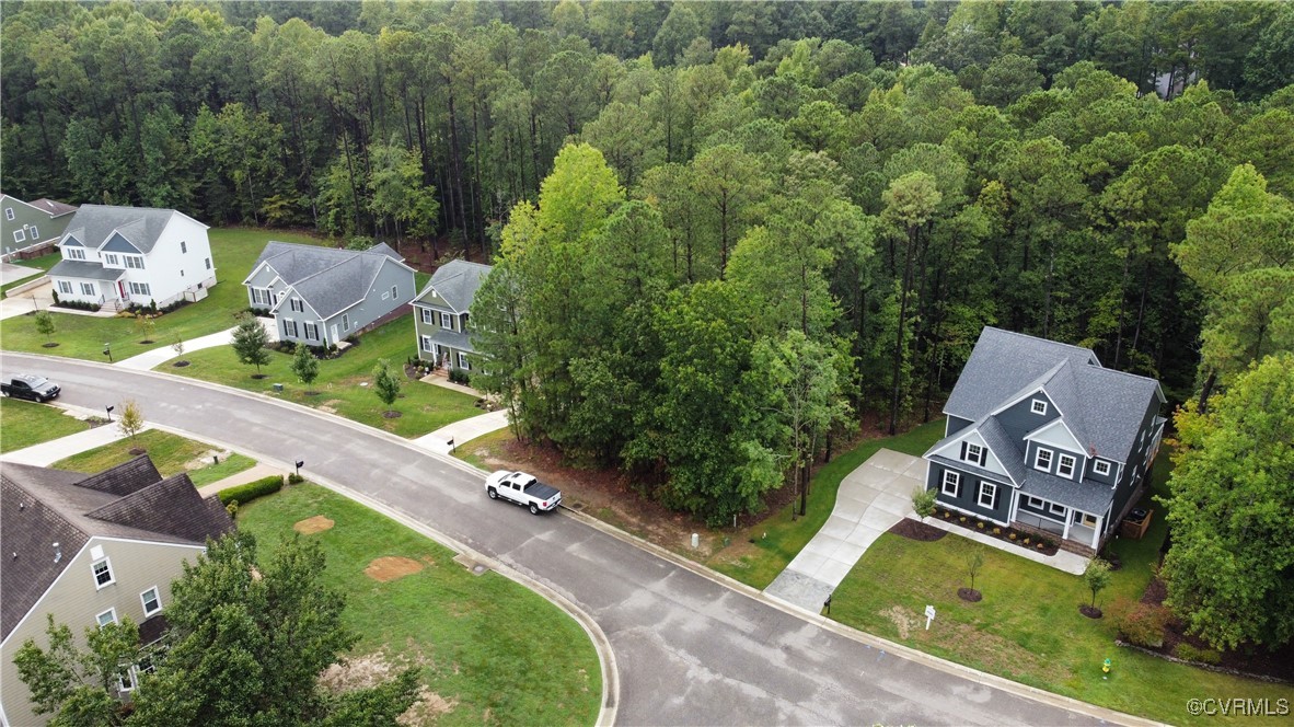 an aerial view of a house with garden space and sitting space