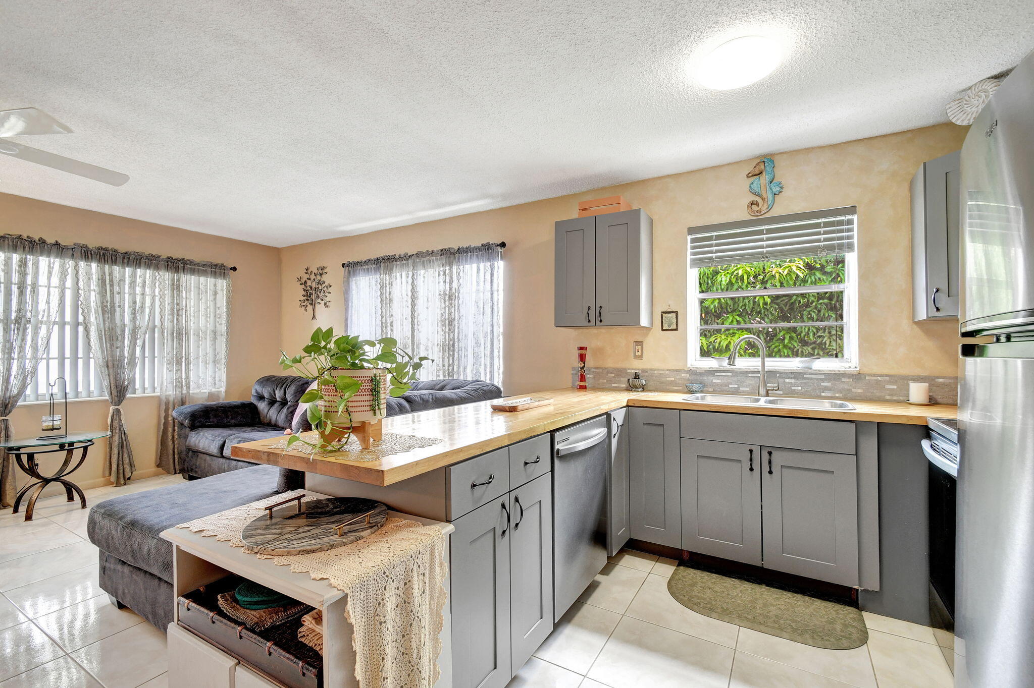 a kitchen with a stove a sink and a refrigerator