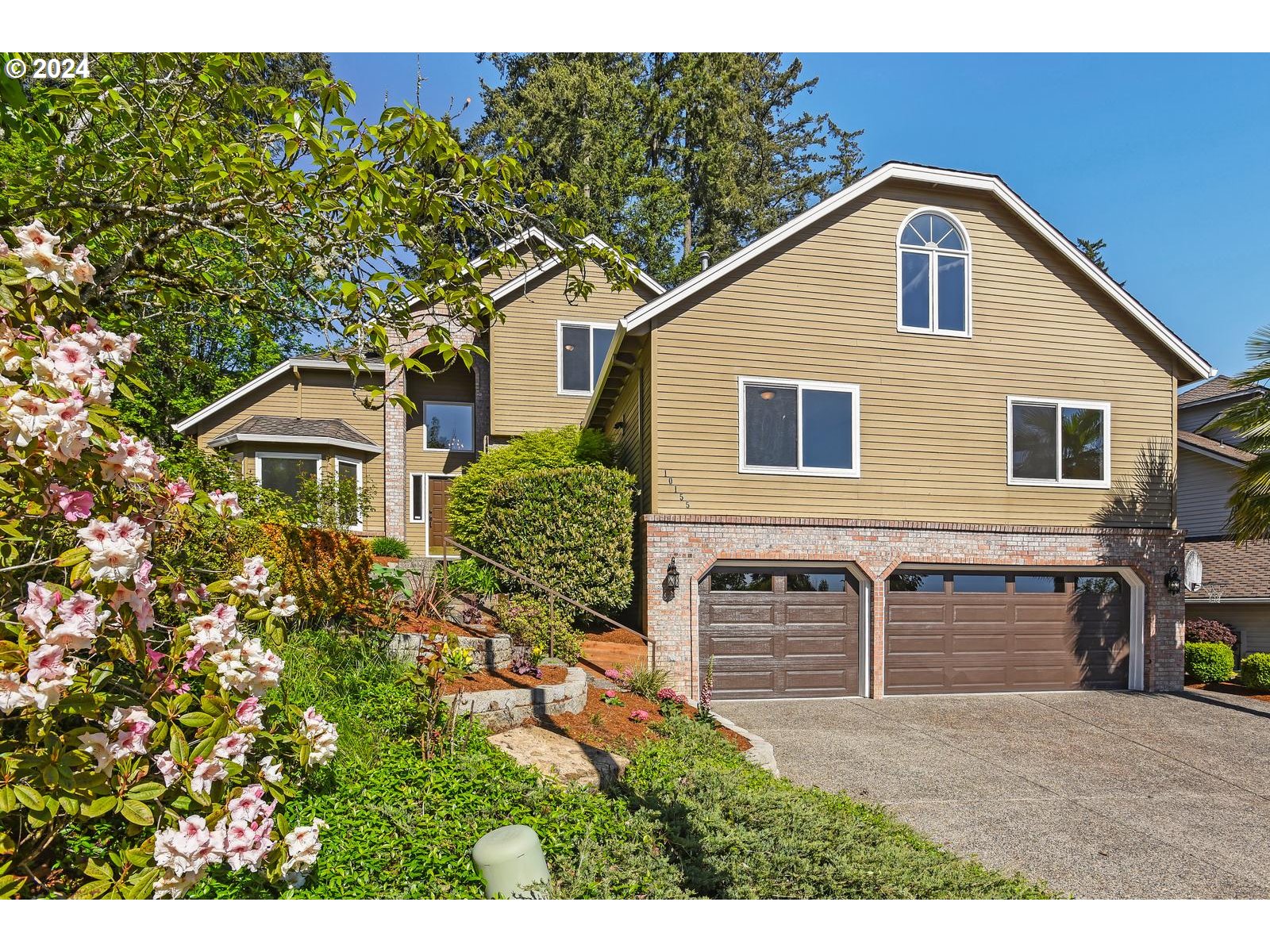 a front view of a house with a yard