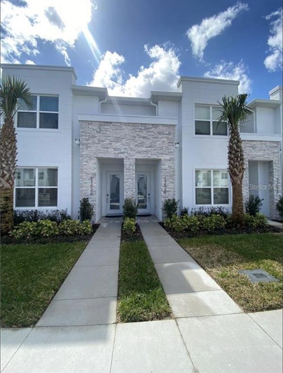 a front view of a house having yard