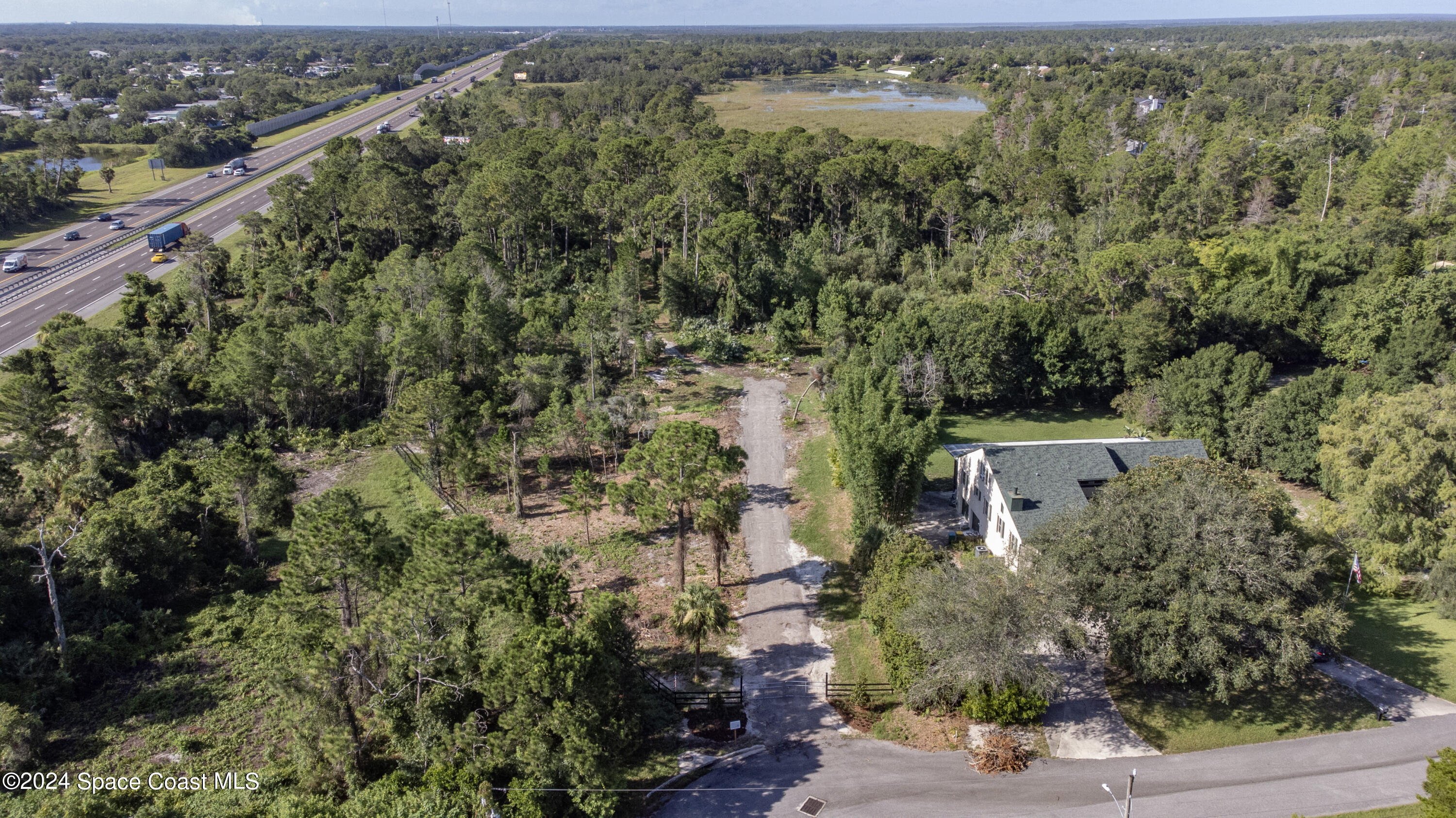 an aerial view of house with yard