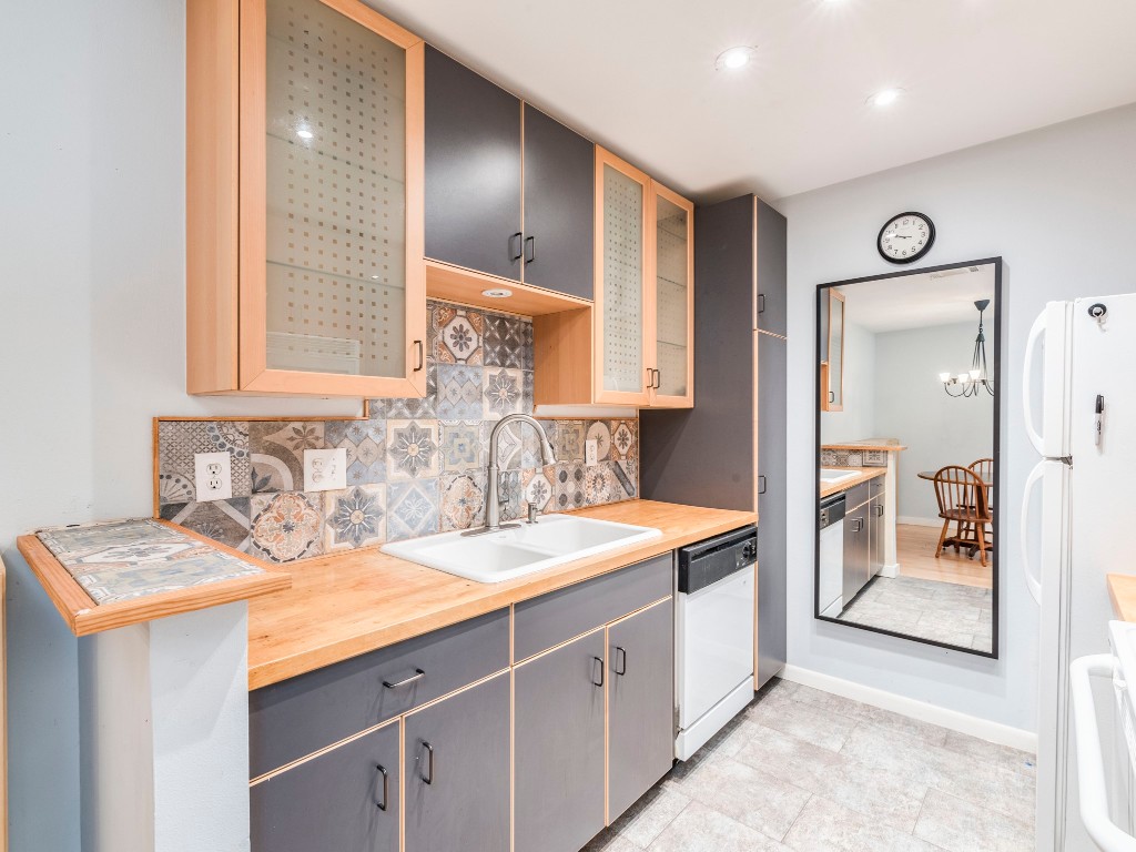 Bright and cheerful updated kitchen with lots of storage and tile flooring