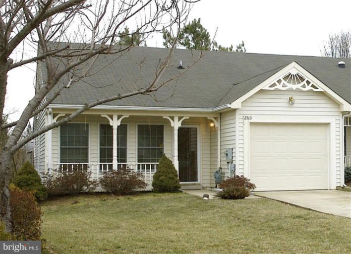 a view of a house with a garden and pathway