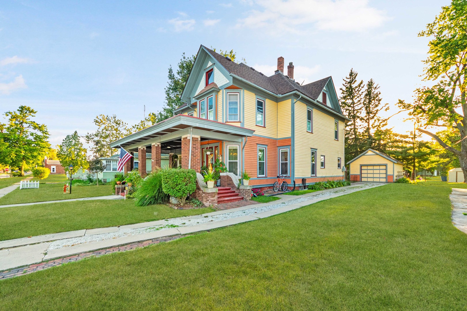 a front view of house with yard and green space