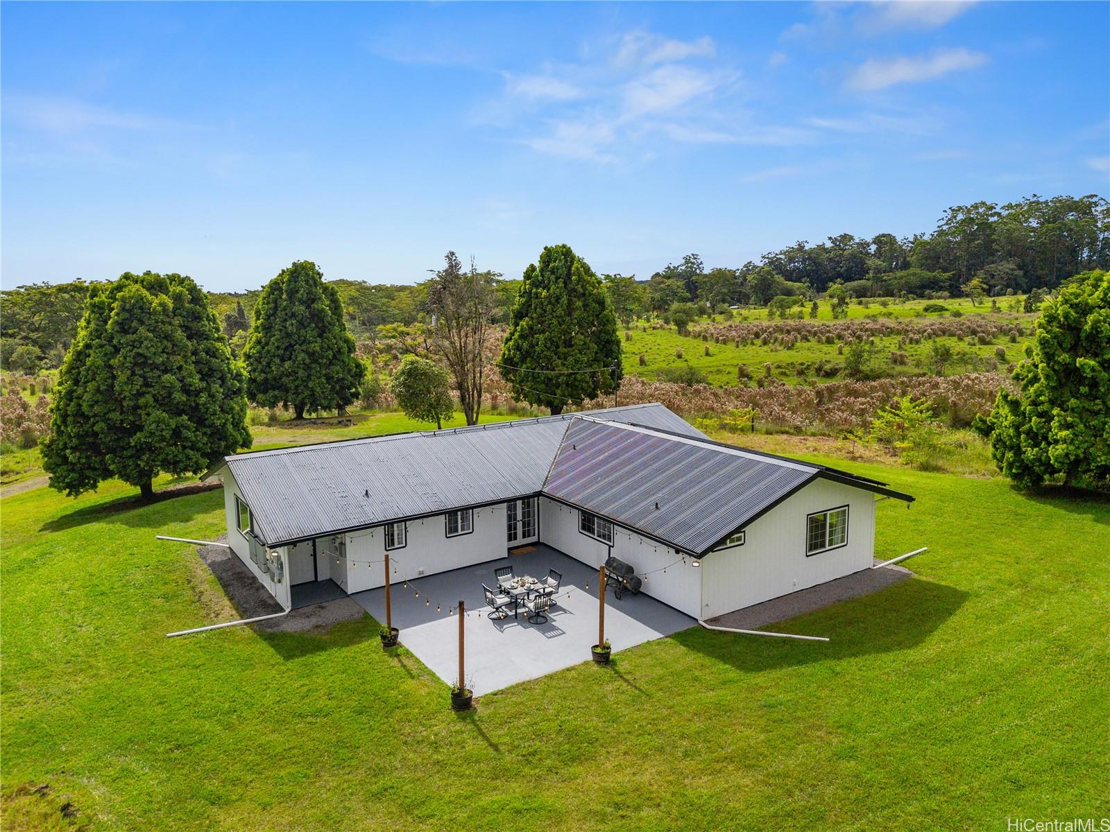 a view of a house with a big yard