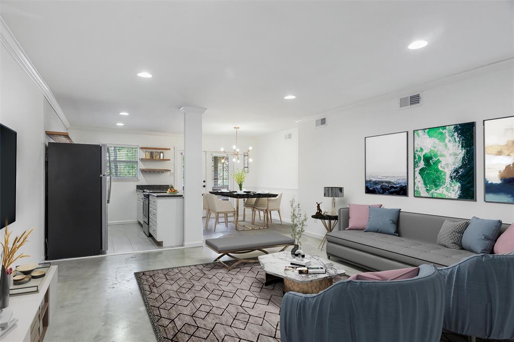 a living room with furniture and a rug