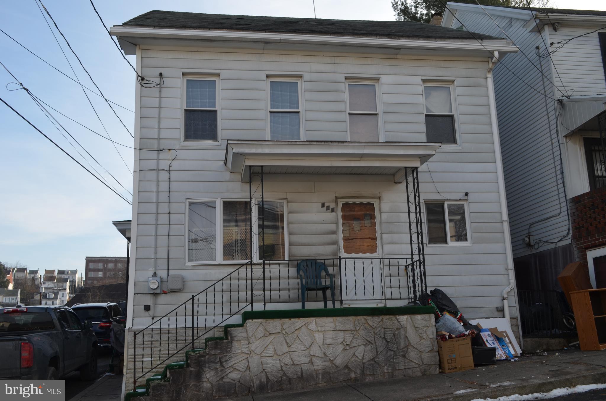 a view of a house with iron stairs