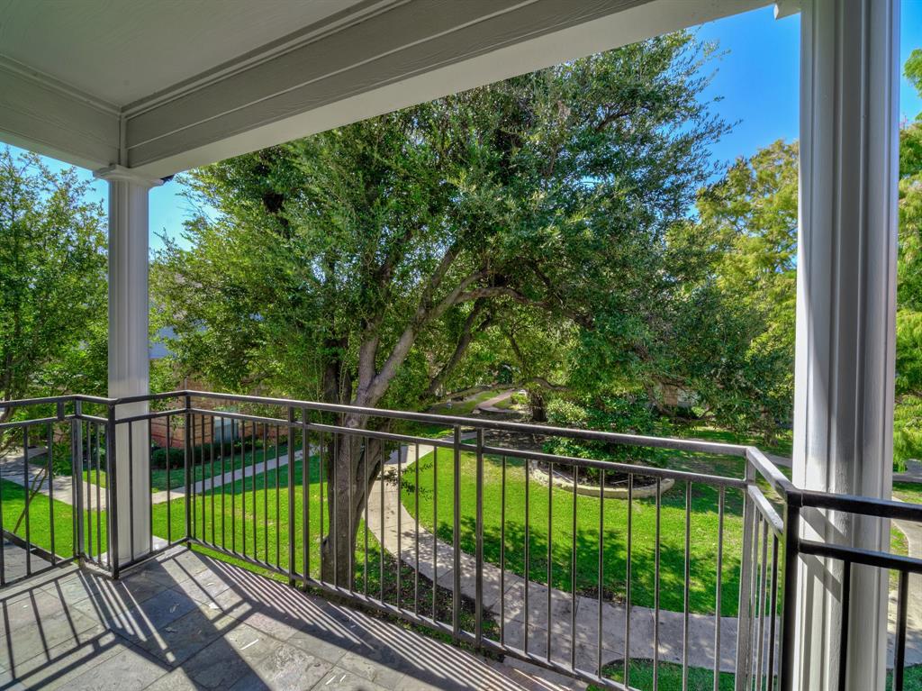 a view of balcony with yard