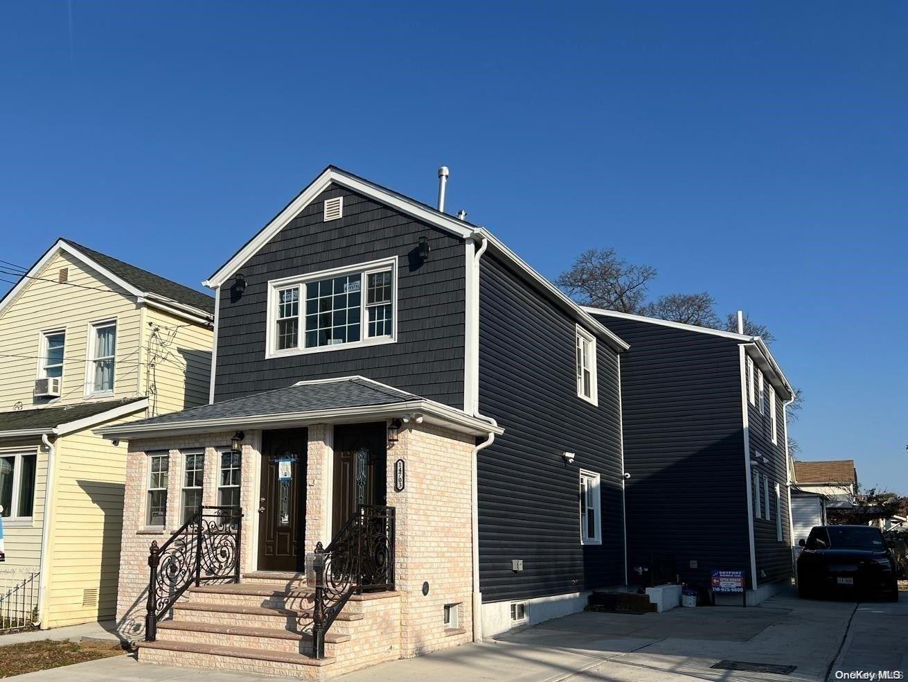 front view of a house with a street