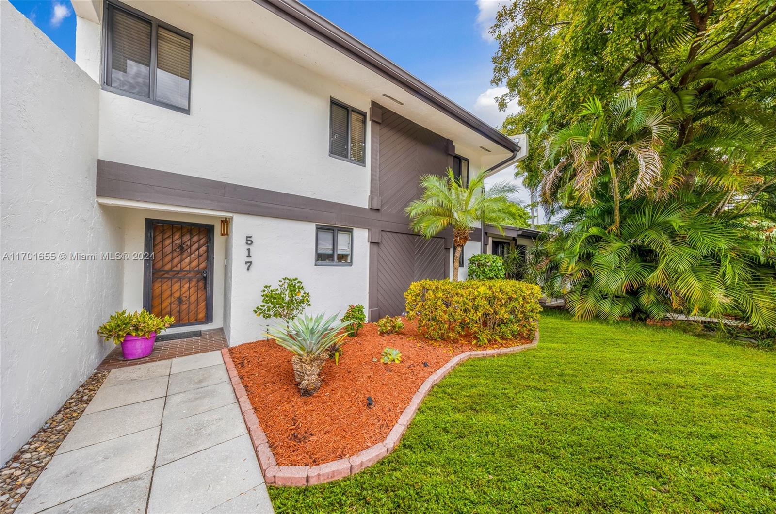 a front view of house with outdoor seating