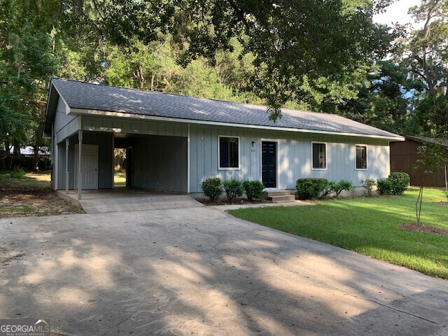 a front view of a house with garden