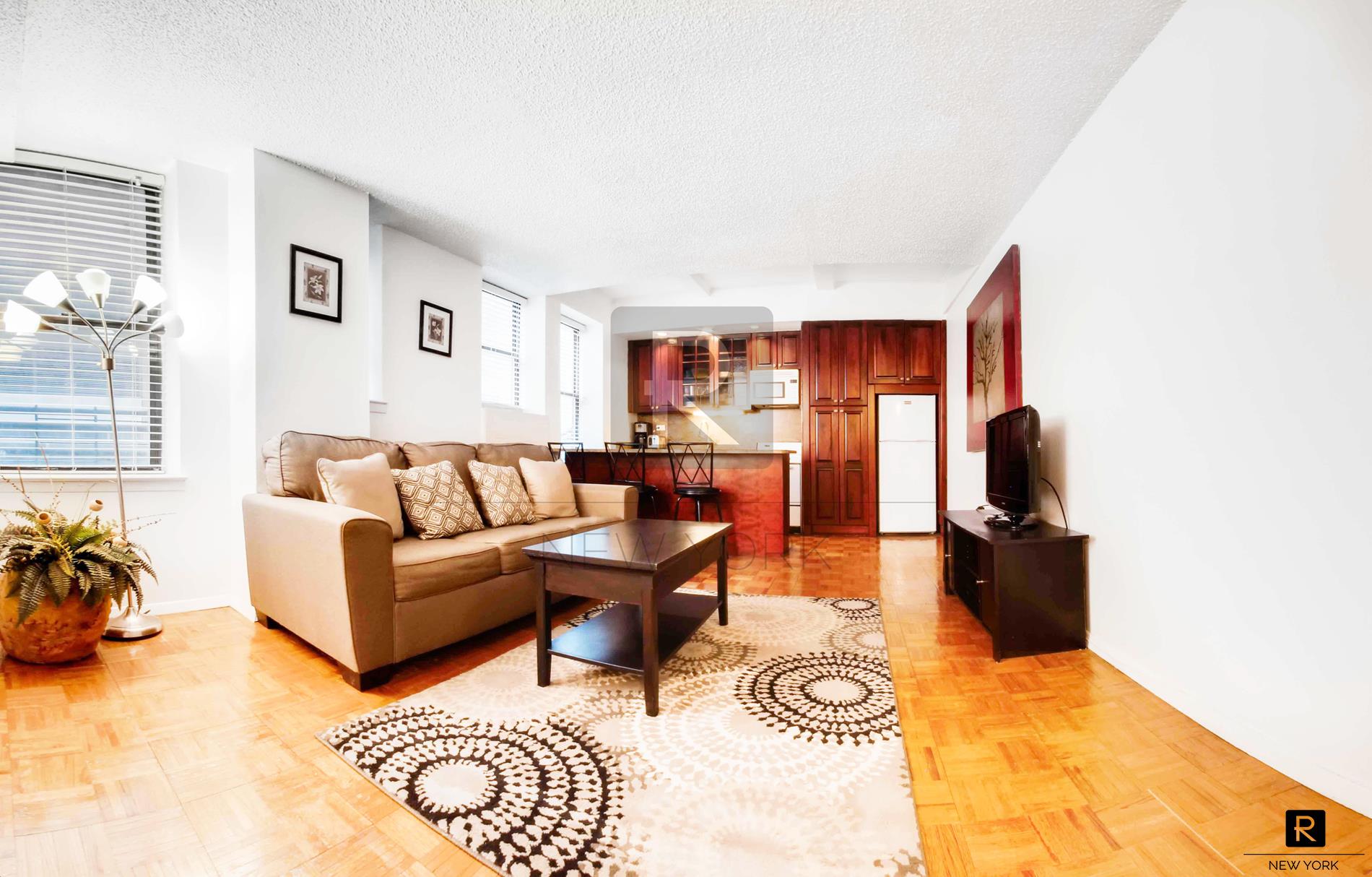 a living room with furniture and a window