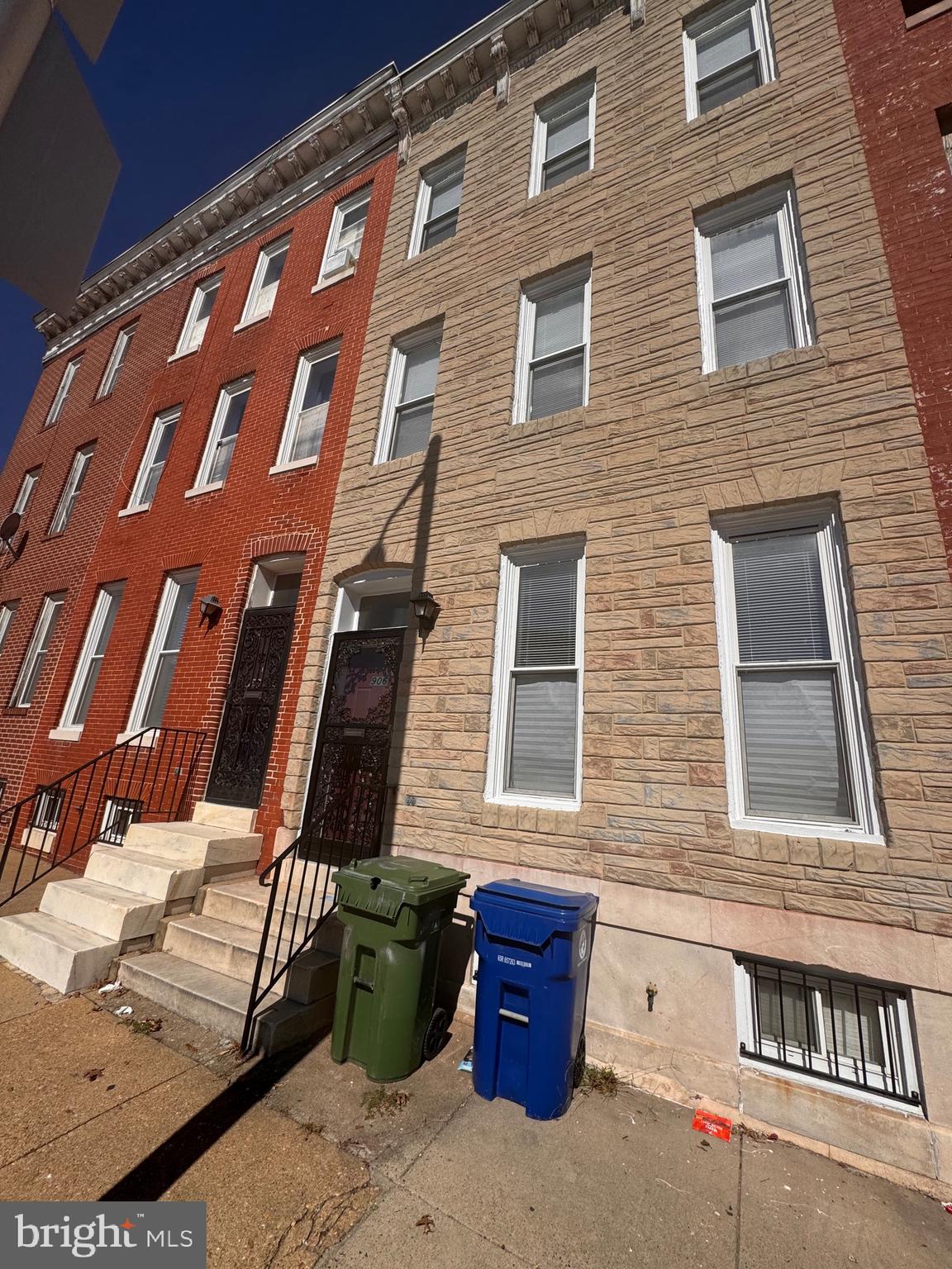 a view of a brick building with many windows