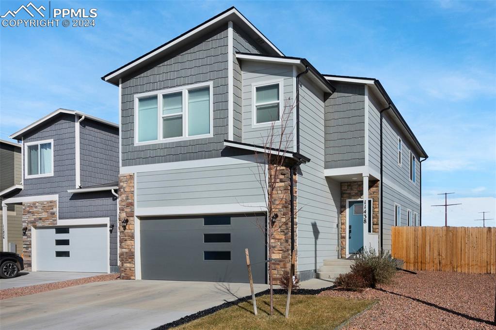 a front view of a house with a garage