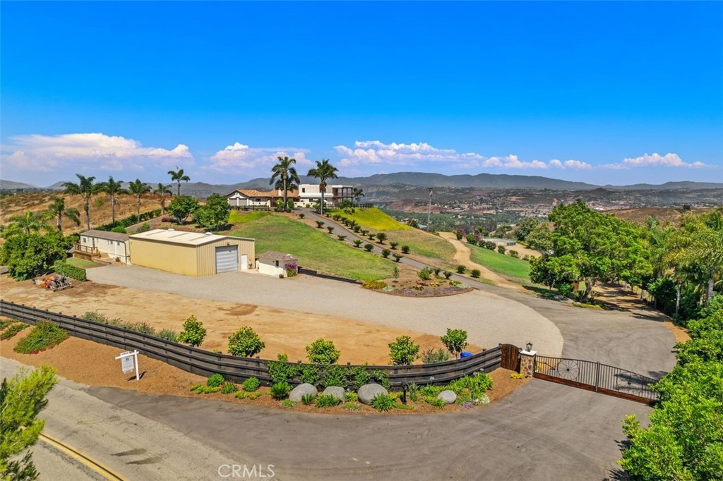 Magnolia Ranch! This Coastal Equine Estate is entered by an oversized double arm private gate. With wagon wheels dating back to the 1700's custom built into the gate. This Ranch property is truly custom and authentic.