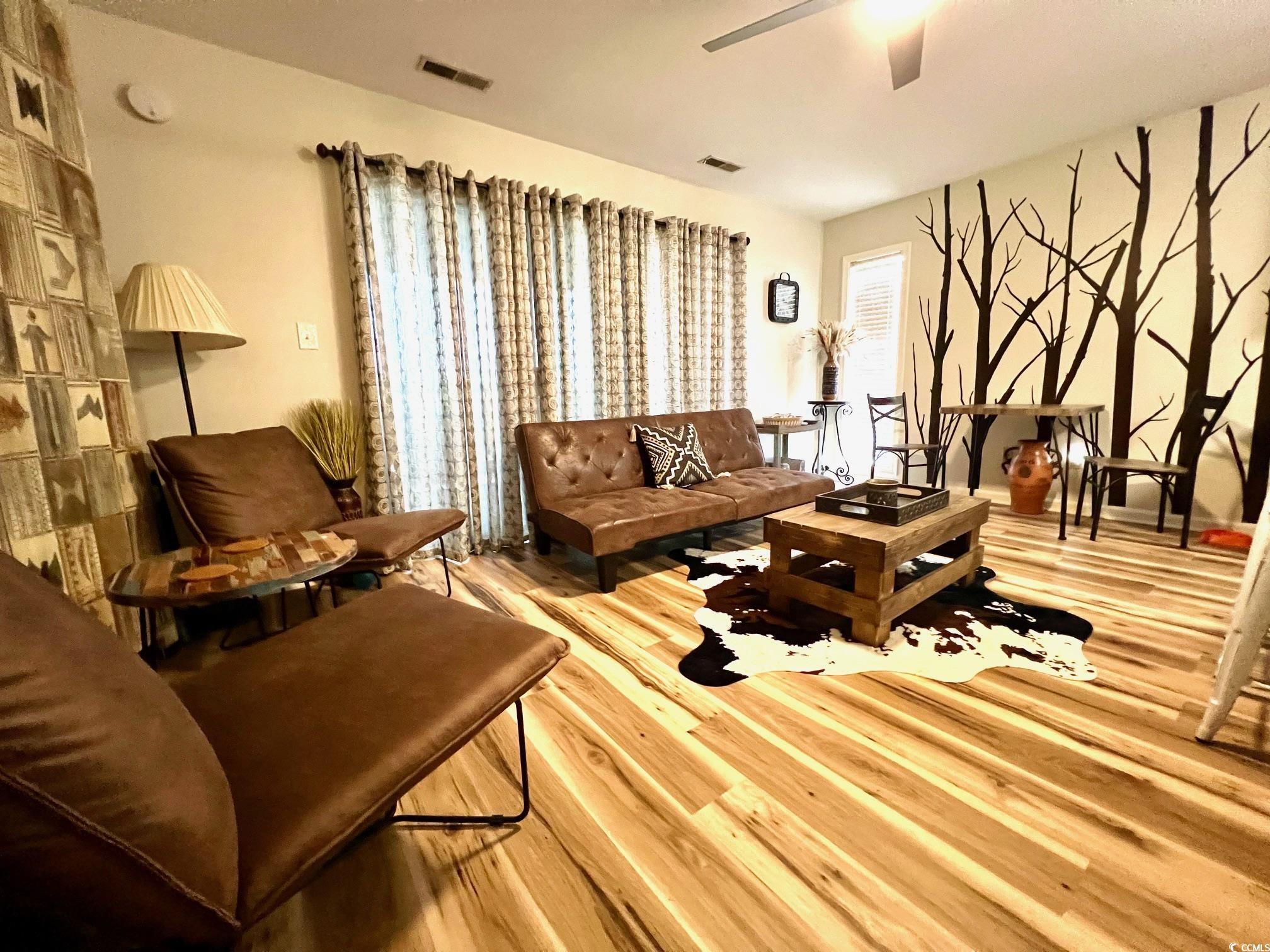 Living room featuring light wood-type flooring and