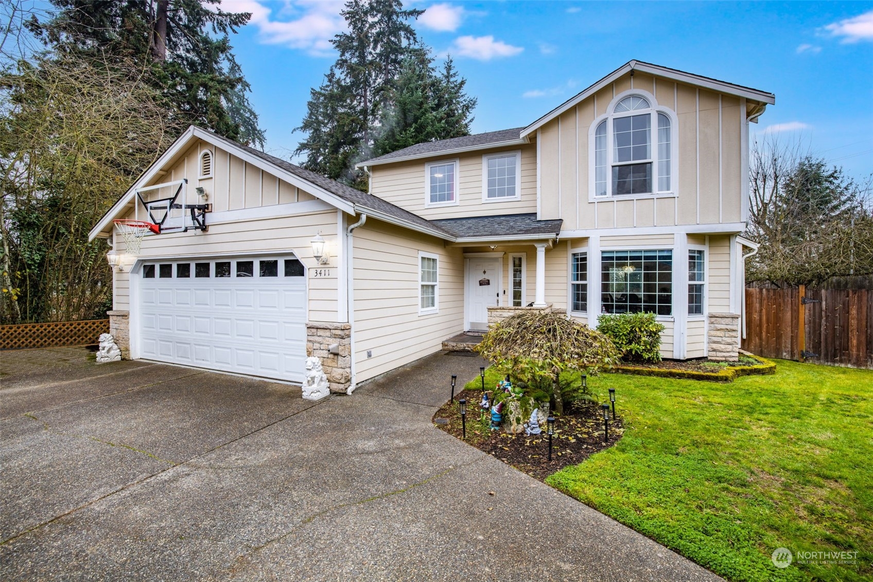 a view of house with yard and entertaining space