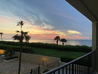 a view of a balcony with ocean view