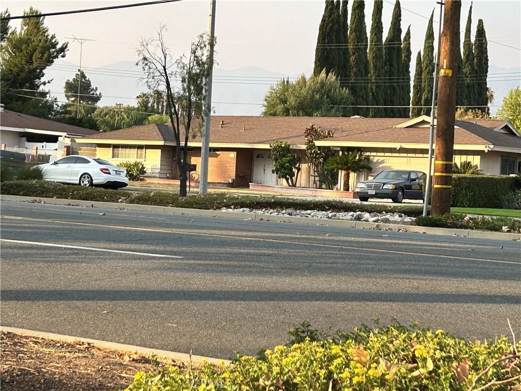 a view of a building with a yard