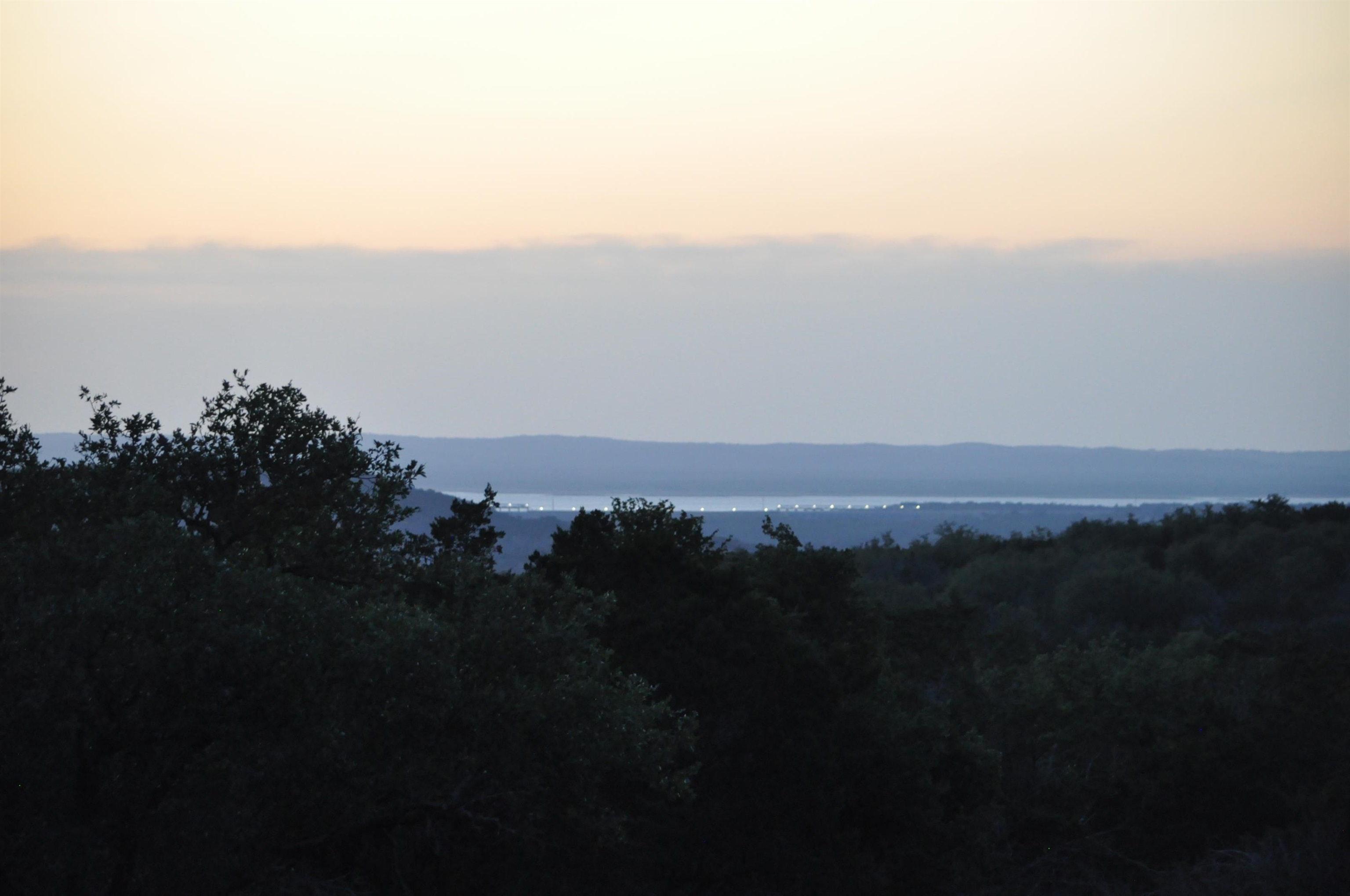 a view of sunset and a city