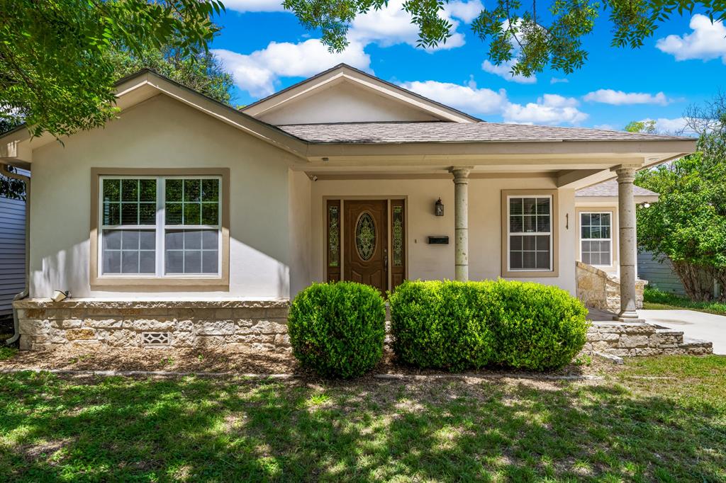 front view of a house with a yard