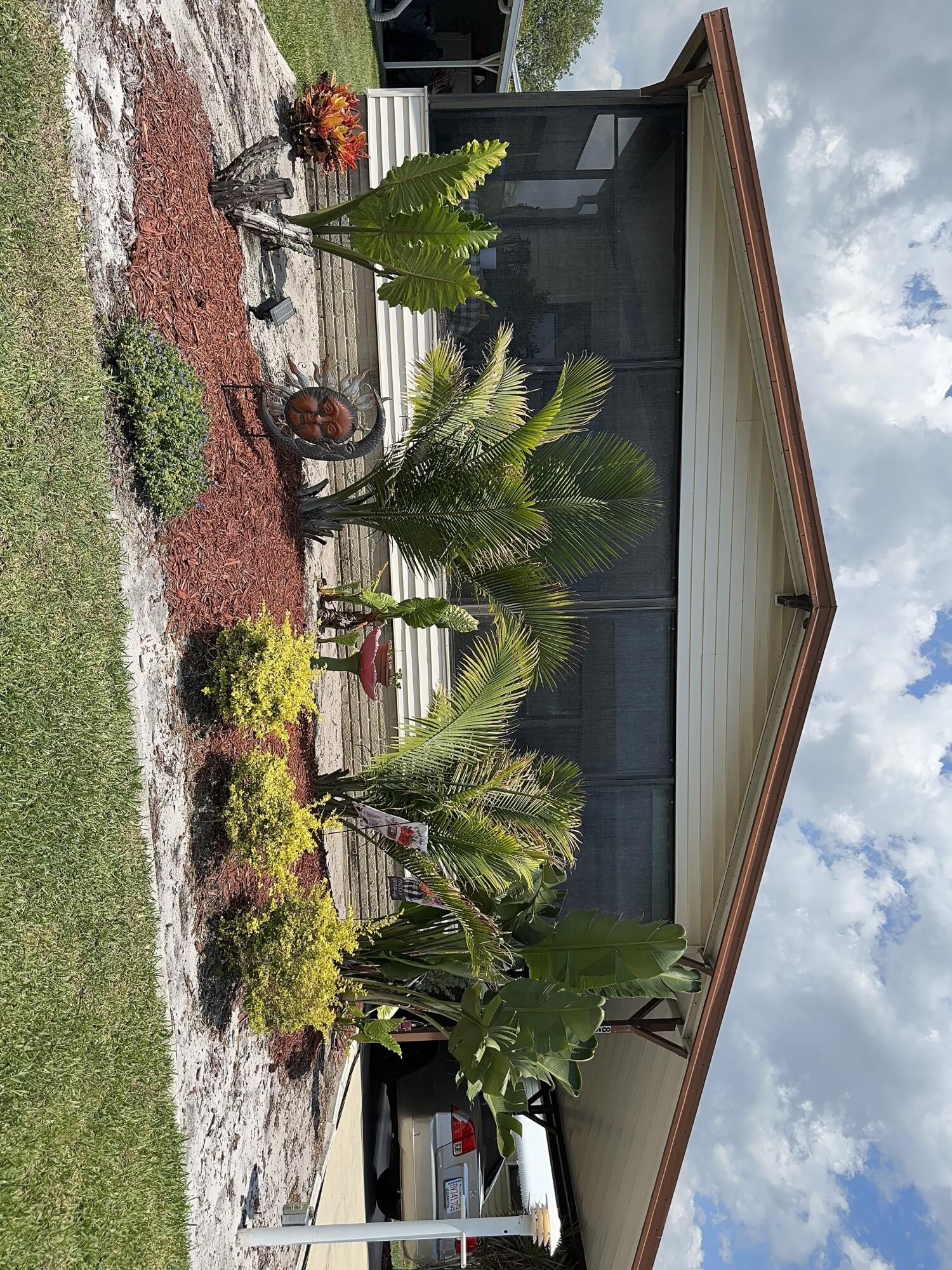 a view of a porch with potted plants