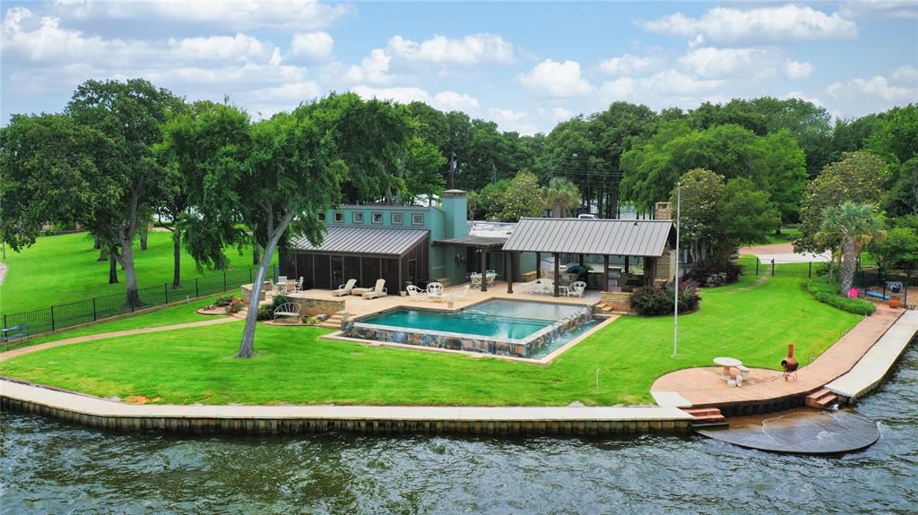 a aerial view of a house with swimming pool and garden