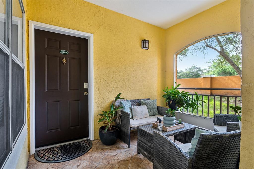 a outdoor living space with furniture and a window