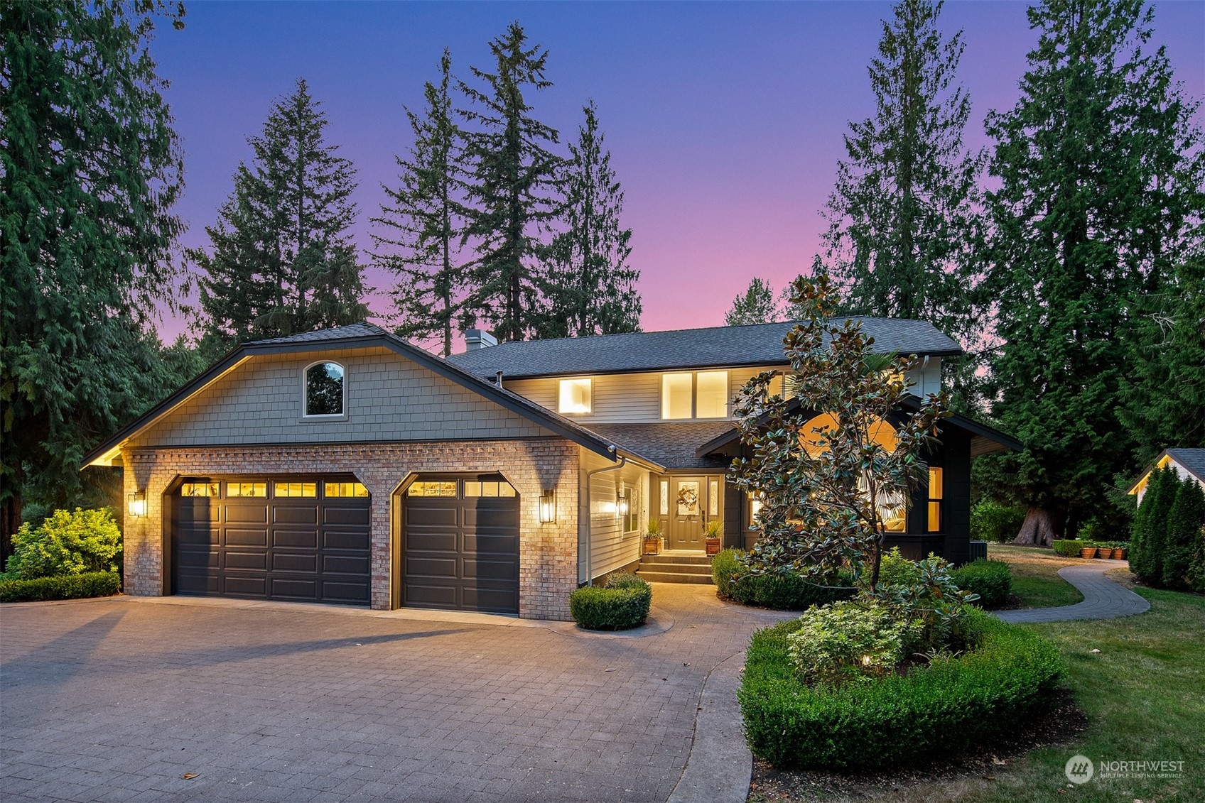 a view of a house with yard and tree s