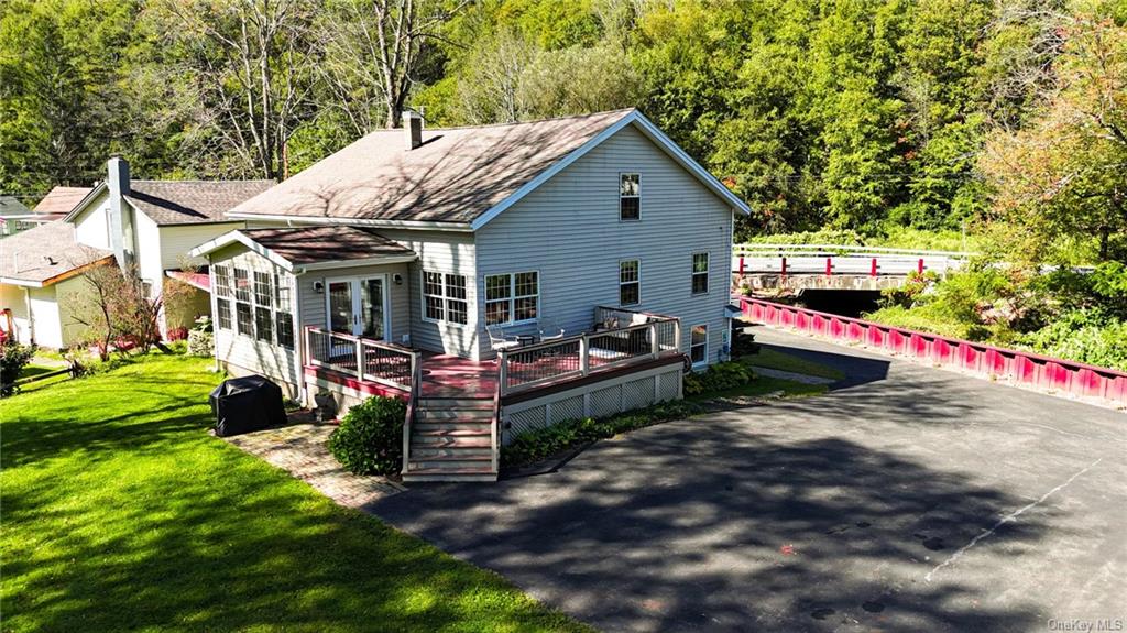 a view of a house with a yard porch and sitting area