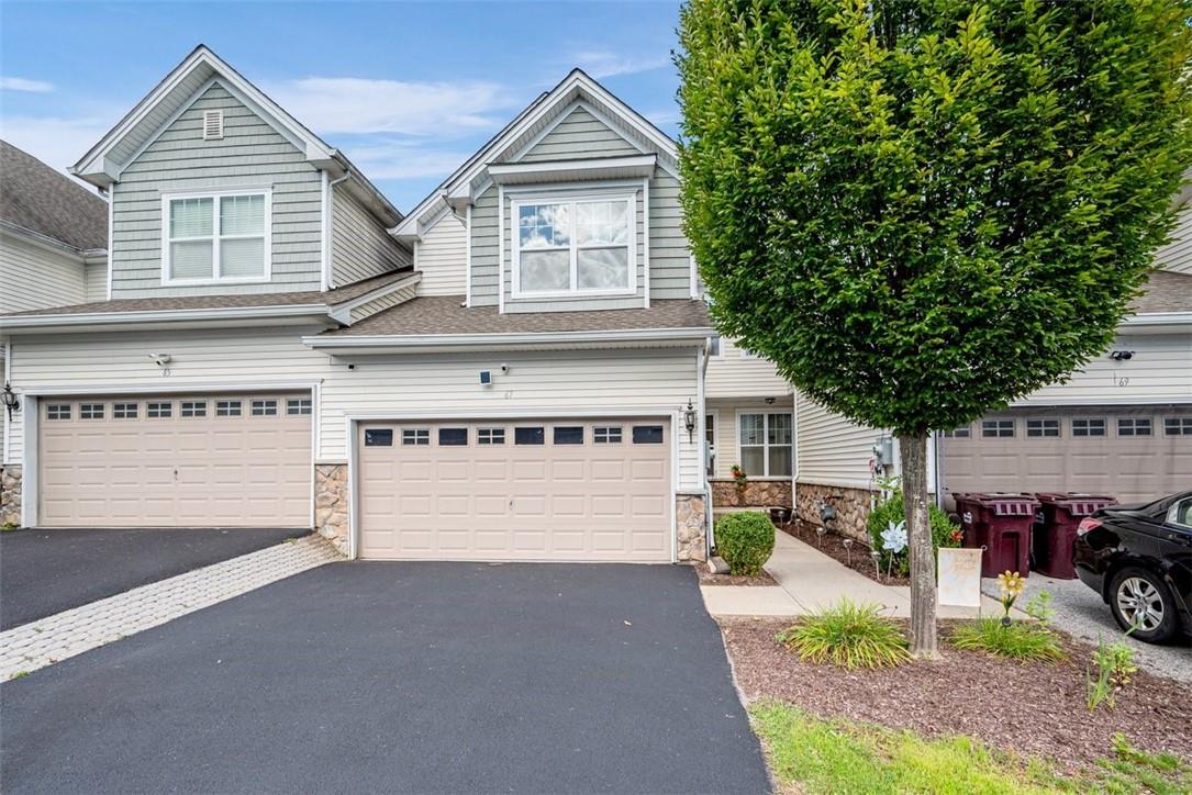 View of front of property featuring a garage