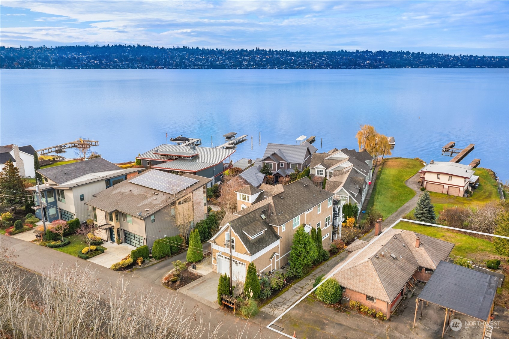 an aerial view of a house with a ocean view