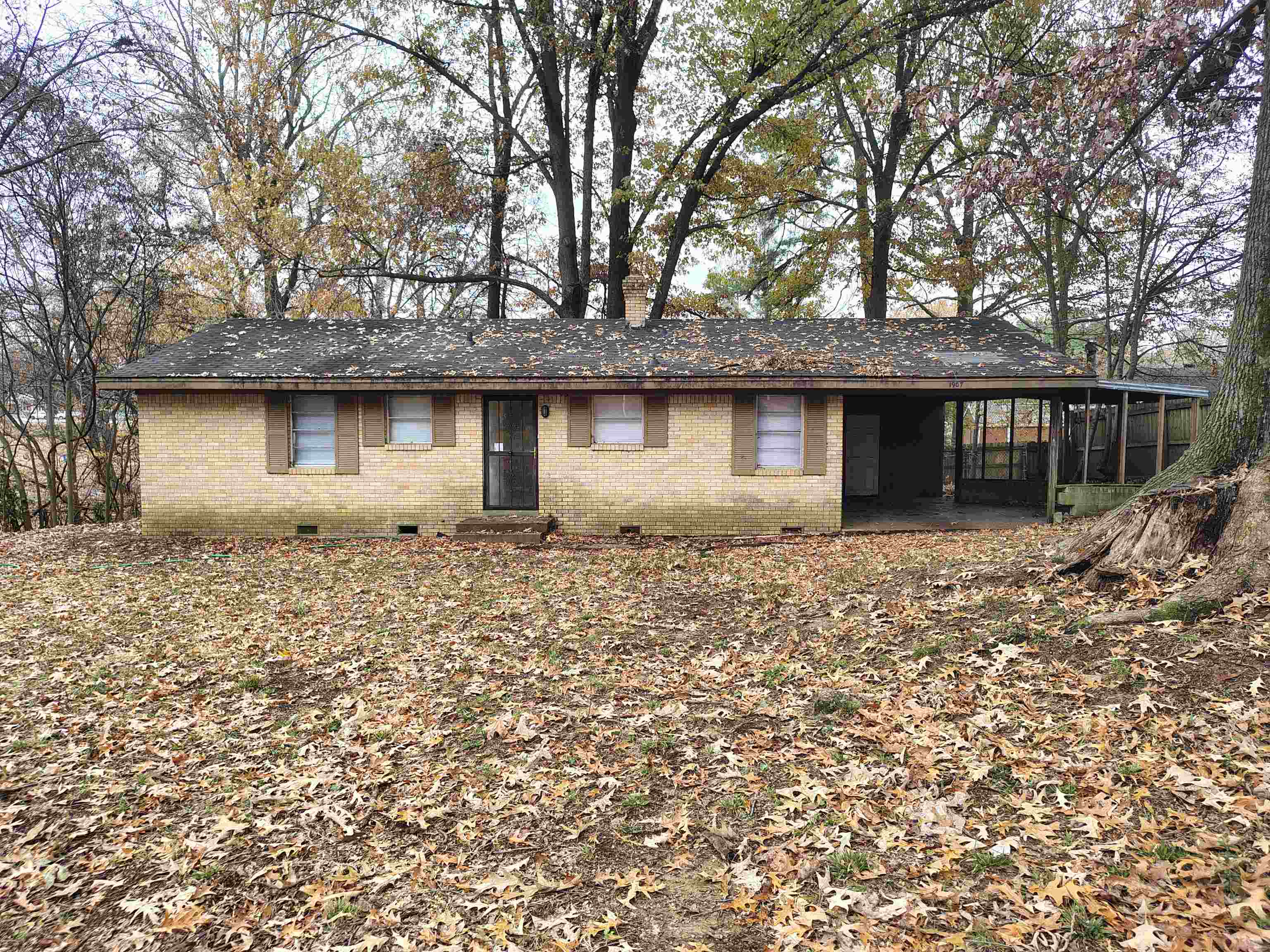 View of front of property with a sunroom