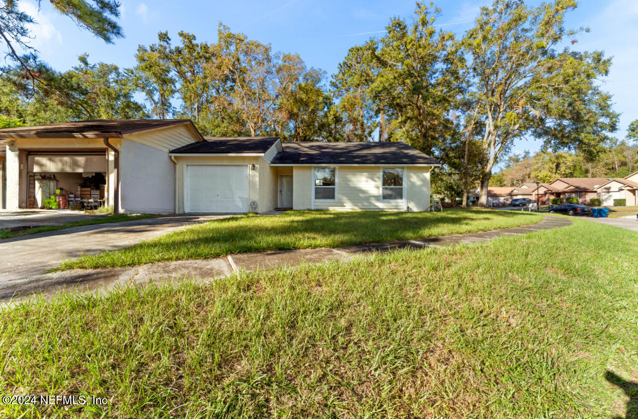 front view of a house with a yard