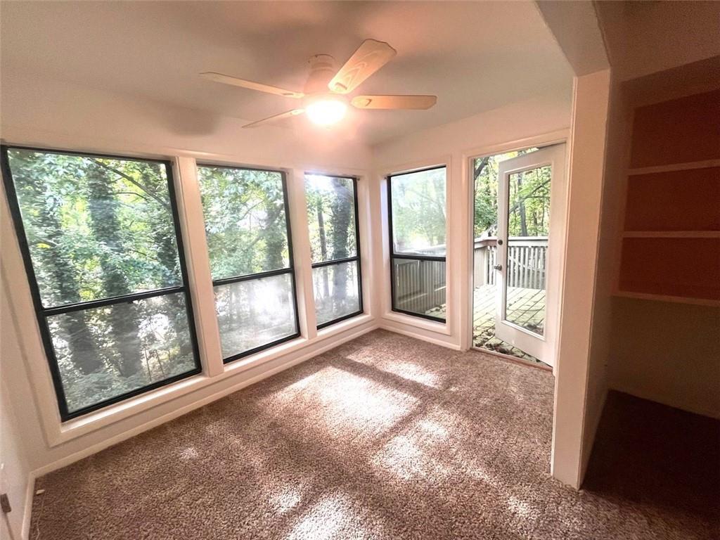 a view of an empty room with a balcony