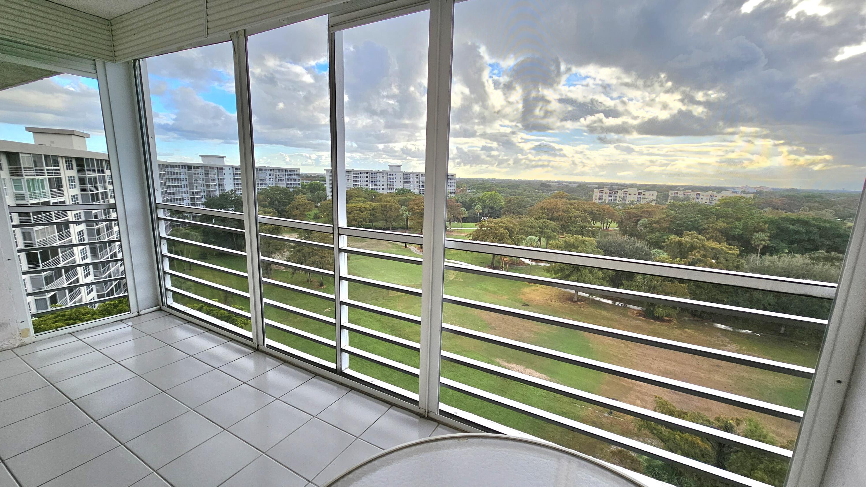 a view of a balcony with mountain view and windows