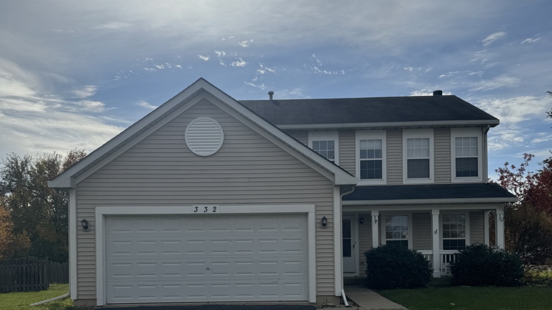 a front view of a house with garage