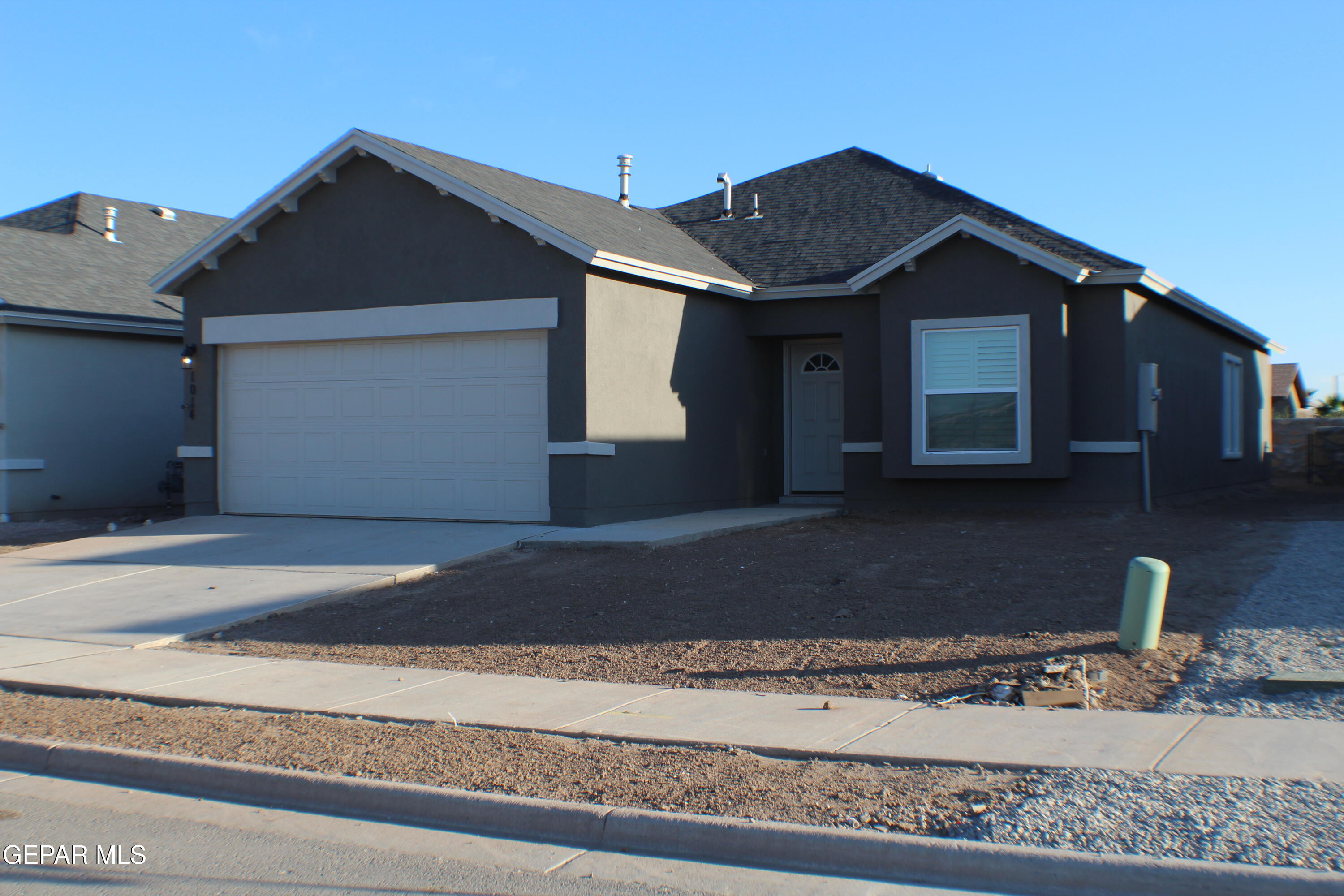 a front view of a house with a garage