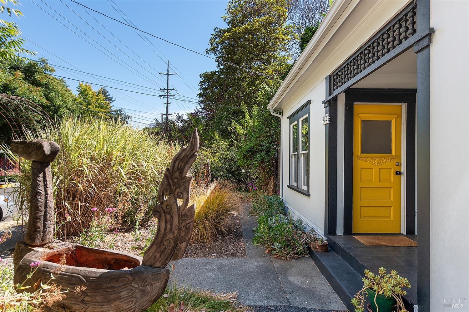 a view of a house with a plants and trees