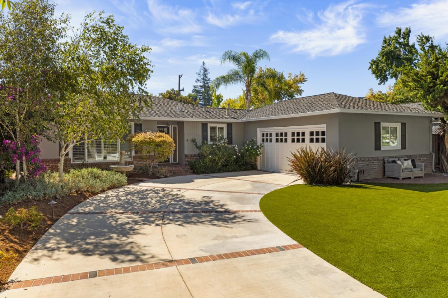 a front view of a house with garden