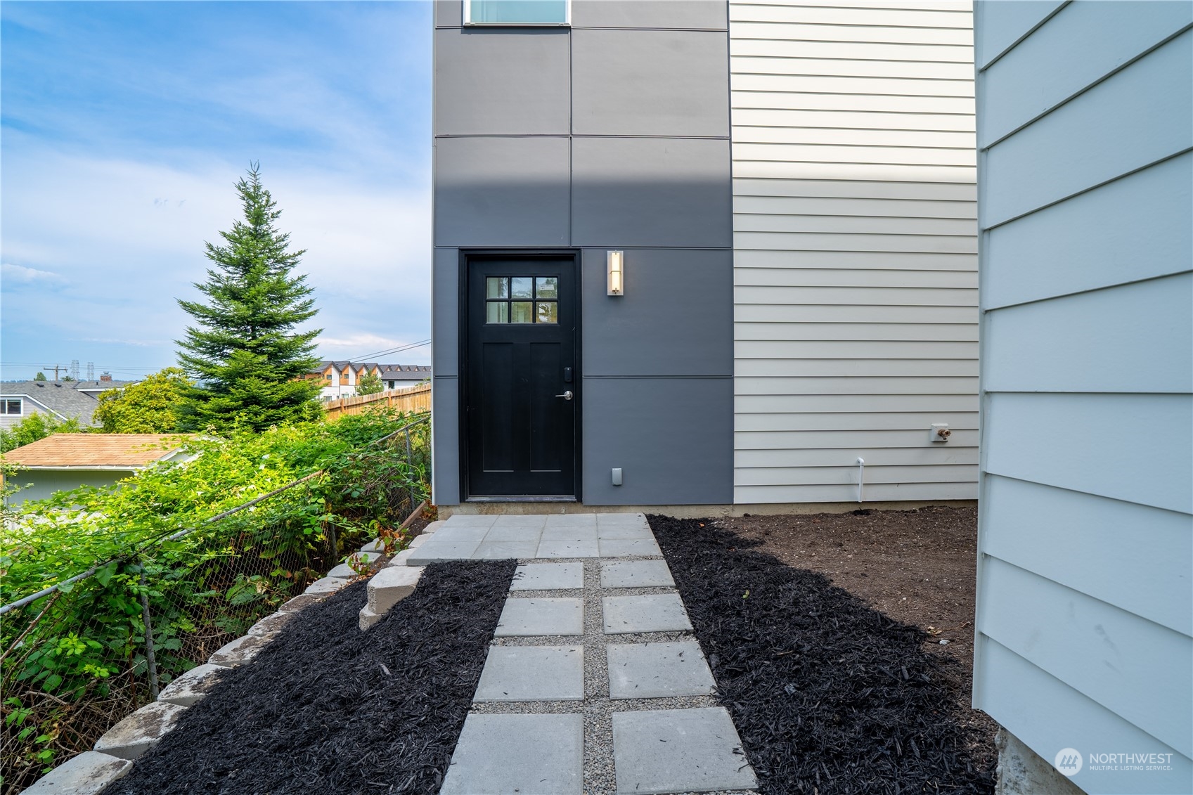 a view of a pathway both side of house